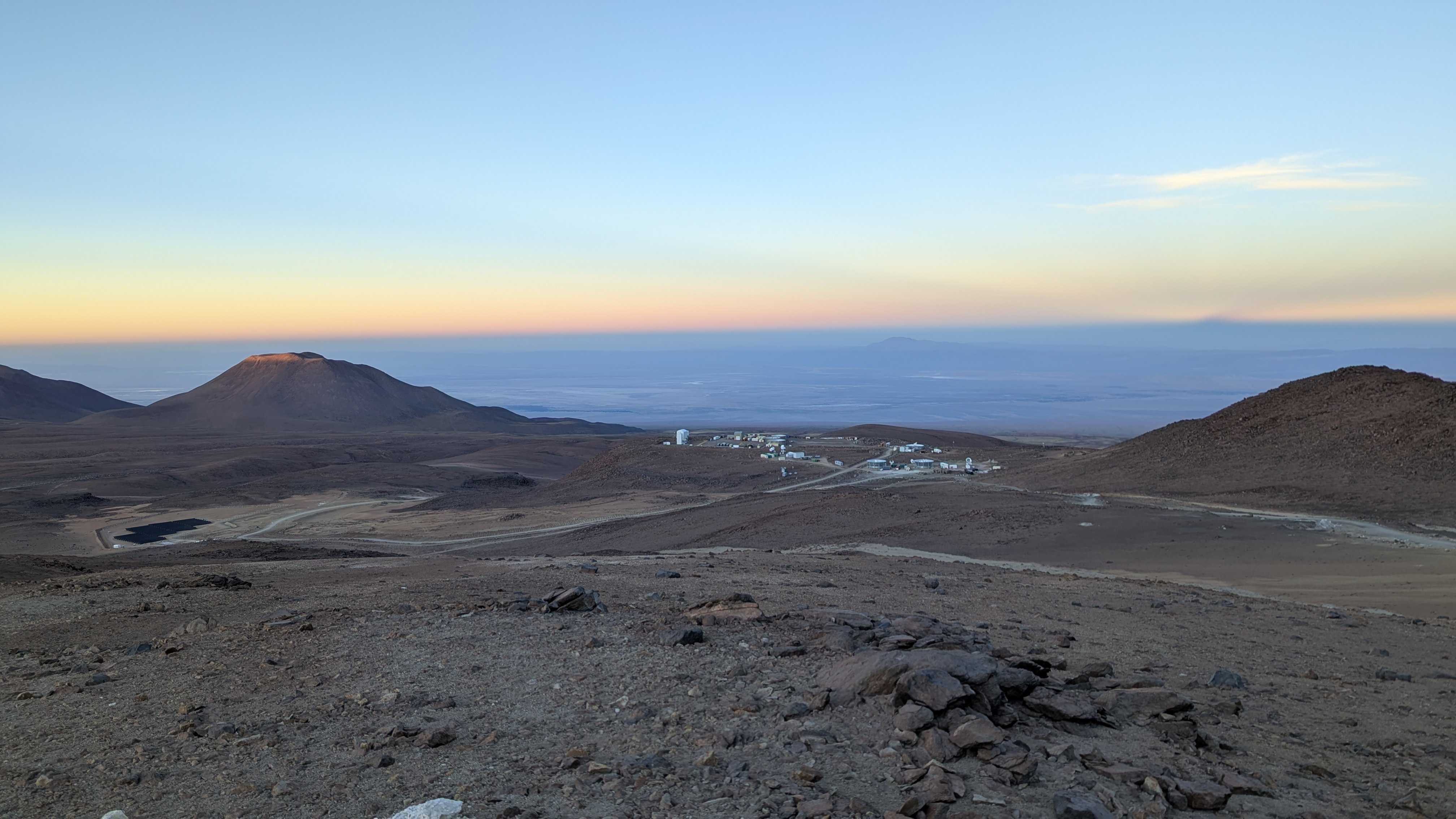 A view of the Simons Observatory site and the surrounding mountains